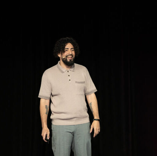 service-02 Ray Martinez smiling on stage at SEO Week 2026