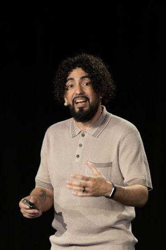 Ray Martinez speaking on stage at SEO Week 2026