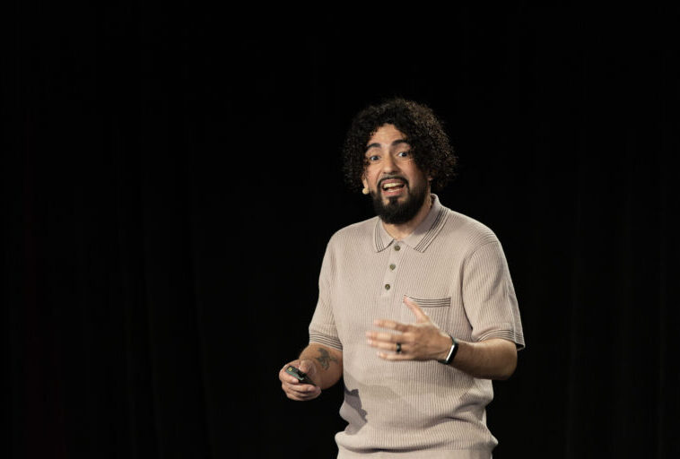 about-me-img Ray Martinez speaking on stage at SEO Week 2026
